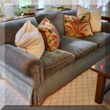 F02. 2 Custom teal blue sofas with ribbon trim. One sofa has some damage to upholstery on arm. 31”h x 90”w x 44”d 